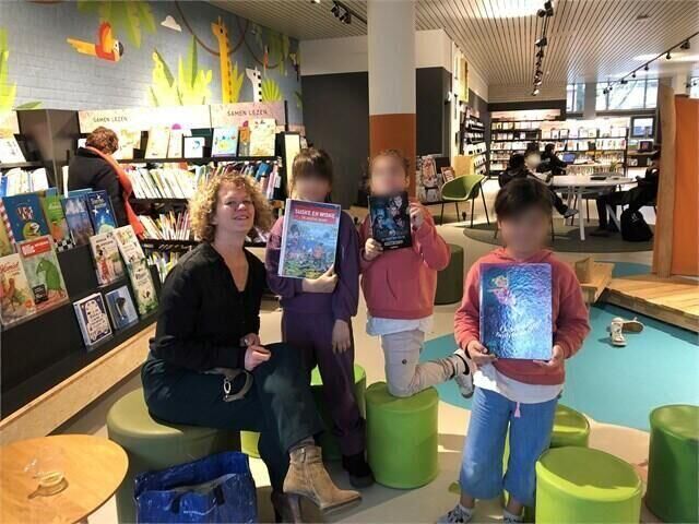 Sponsoring children's book 'De Spoken van het Stadhuis' and reading sessions